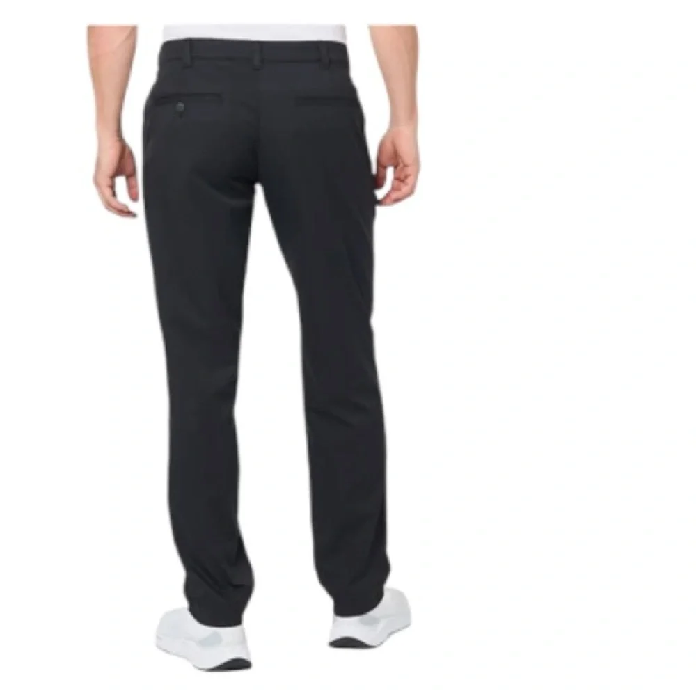 Nike Golf Tour Performance Dri-Fit black golf pants. Flat front Nike logo 40/26